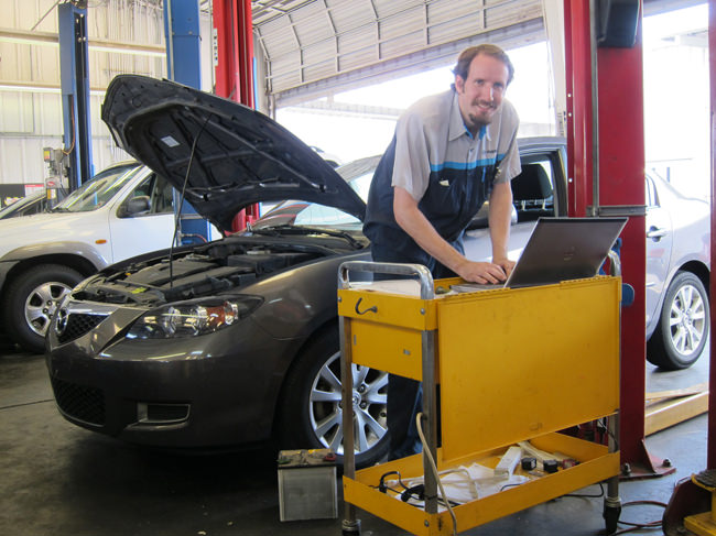 Adam working on a Mazda 6